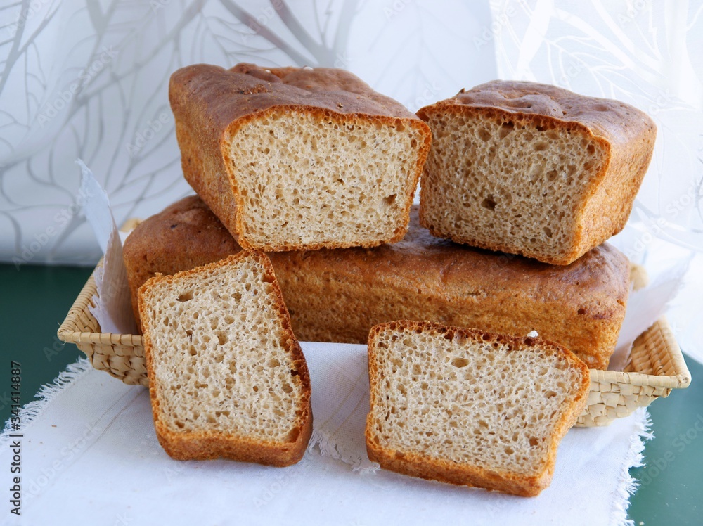 Tasty homemade loaf and slices of bread Tasty homemade loaf and slices of bread