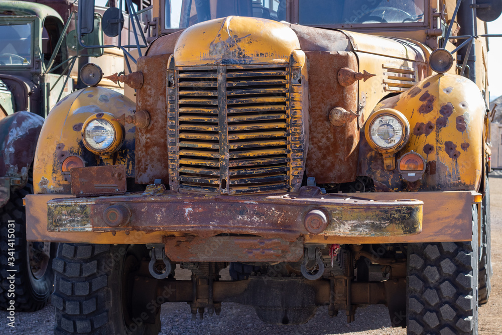 Military style transport truck rusting in the desert