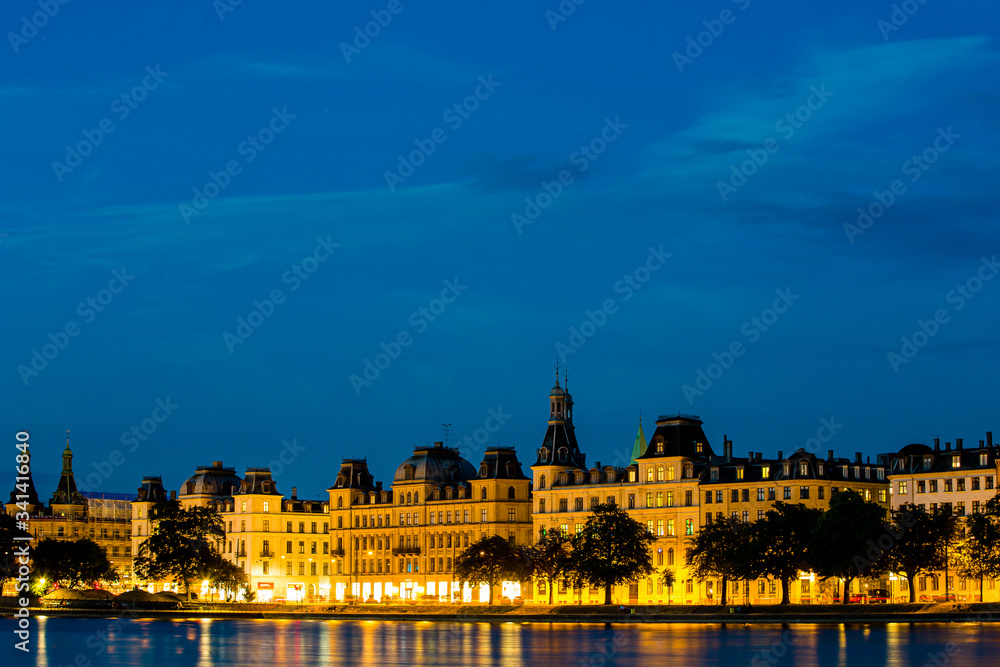Twilight view of old historical buildings in Copenhagen over the water