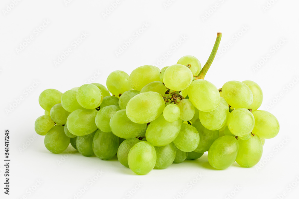 One bunch of ripe organic white grapes isolated on white background, side view
