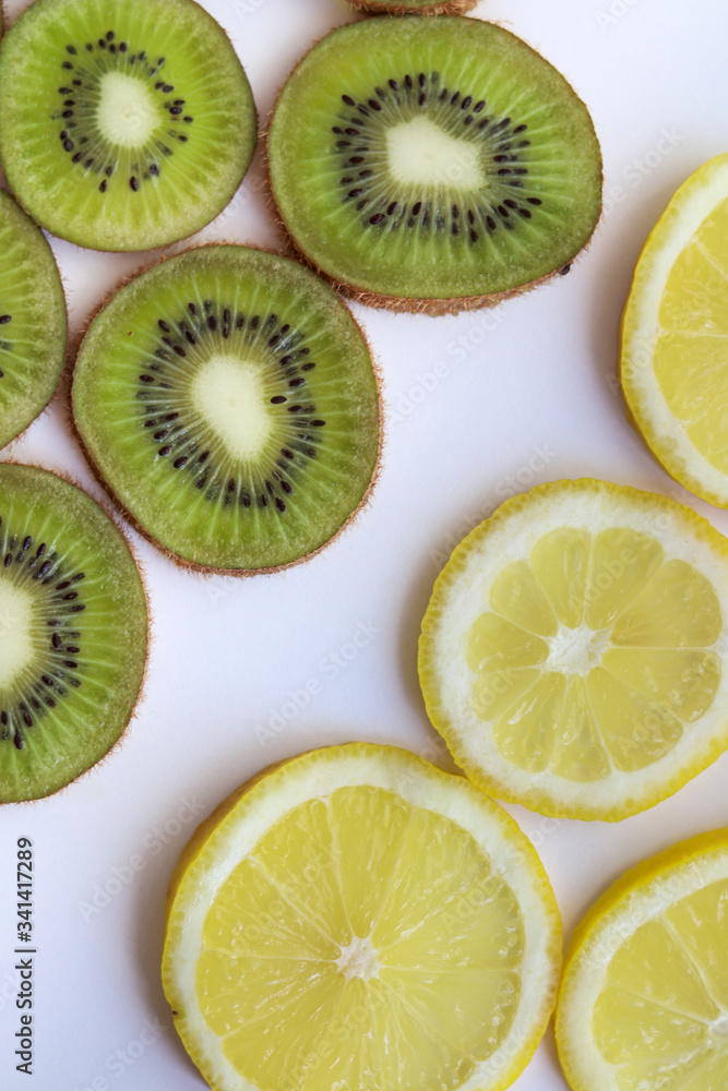 kiwi and lemon slices on a white background with natural light kiwi and lemon slices on a white background with natural light