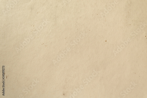 Sloppy texture of old beige cardboard paper. Light vintage background.