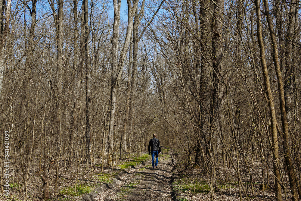 man walking in the woods