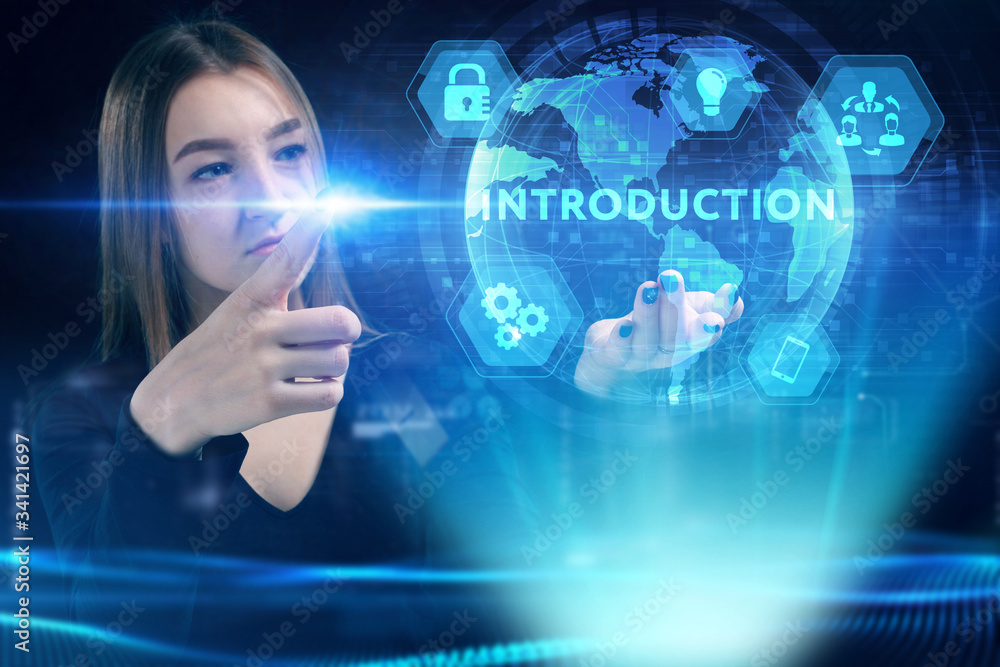 Fototapeta premium Business, Technology, Internet and network concept. Young businessman working on a virtual screen of the future and sees the inscription: Introduction