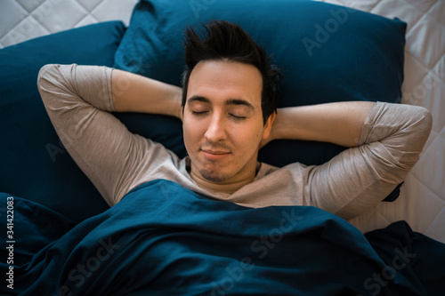 Sweet dreams. Health care concept. Circadian rhythm regulates sleep wake cycle. Man handsome unshaven guy in bed.