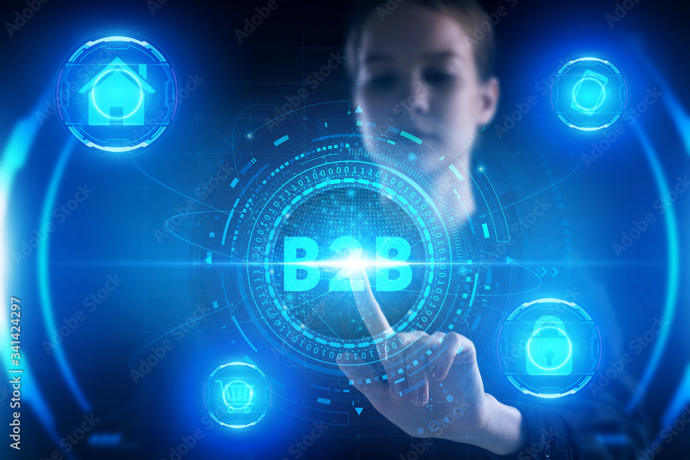 Business, Technology, Internet and network concept. Young businessman working on a virtual screen of the future and sees the inscription: B2B Business, Technology, Internet and network concept. Young businessman working on a virtual screen of the future and sees the inscription: B2B
