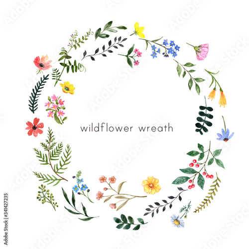 Watercolor wildflowers and herbs wreath with blank space for text. Hand drawn...