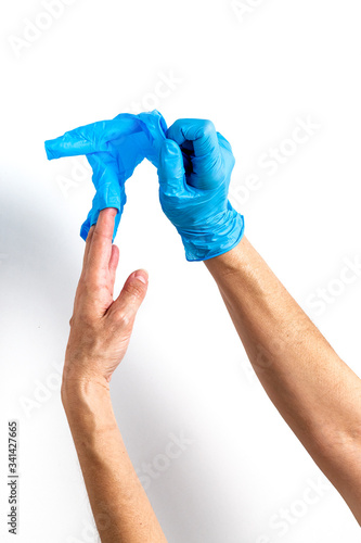 Hands with latex gloves preparing the coronavirus vaccine