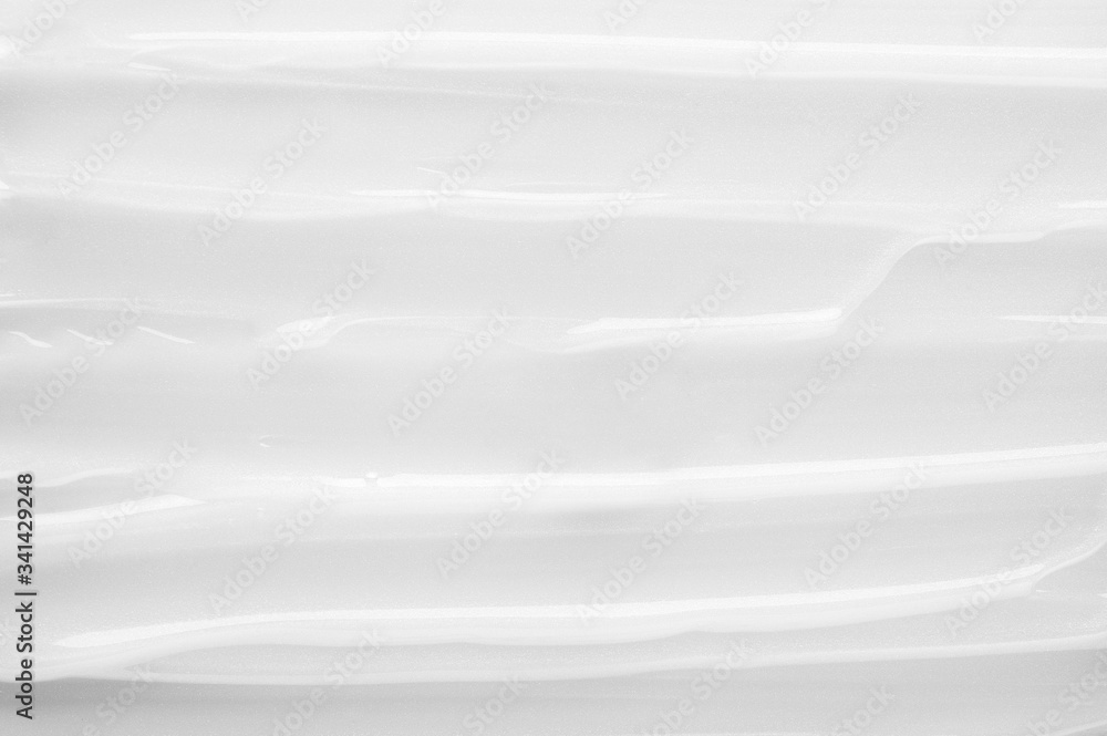 Obraz premium Creamy texture filling backdrop. Cosmetics skincare product for facial treatment. Soft and moisturizing liquid for body or face. Cosmetology wellness and beauty concept