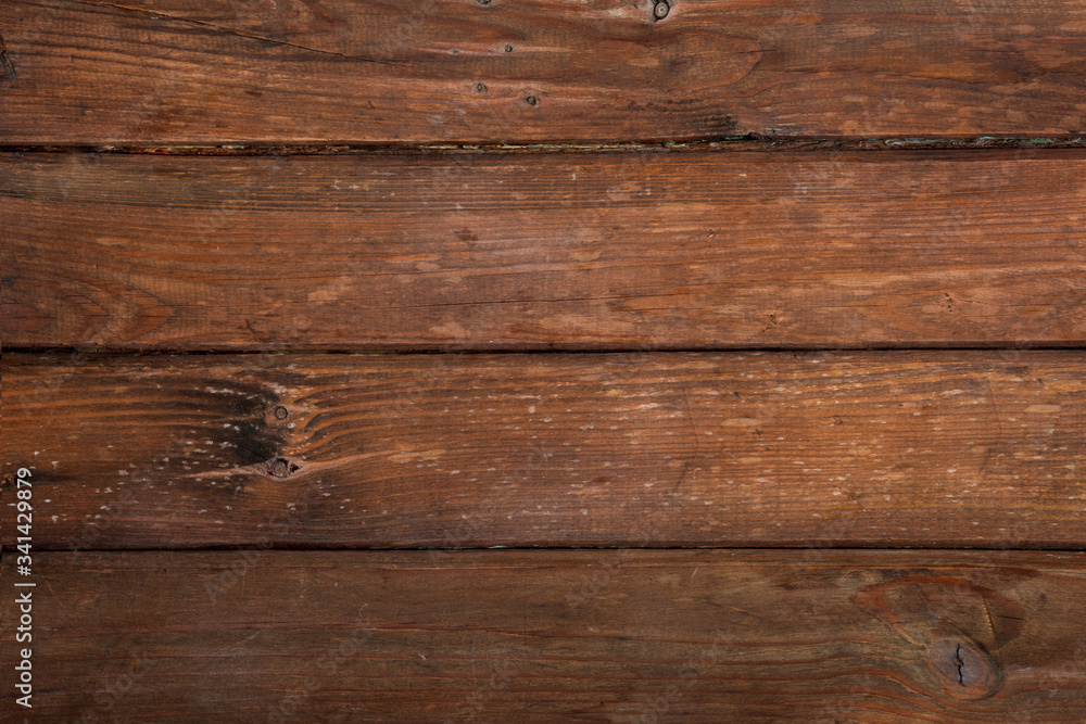 Brown scratched wooden cutting board. Wood texture Brown scratched wooden cutting board. Wood texture
