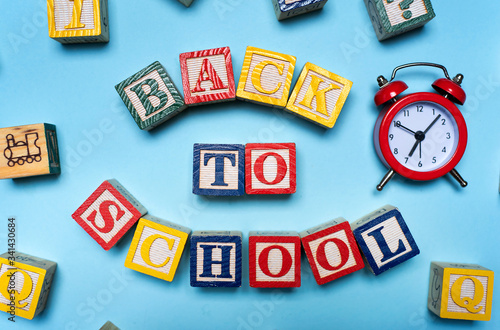 Fotografija Back to school note written with wooden letters