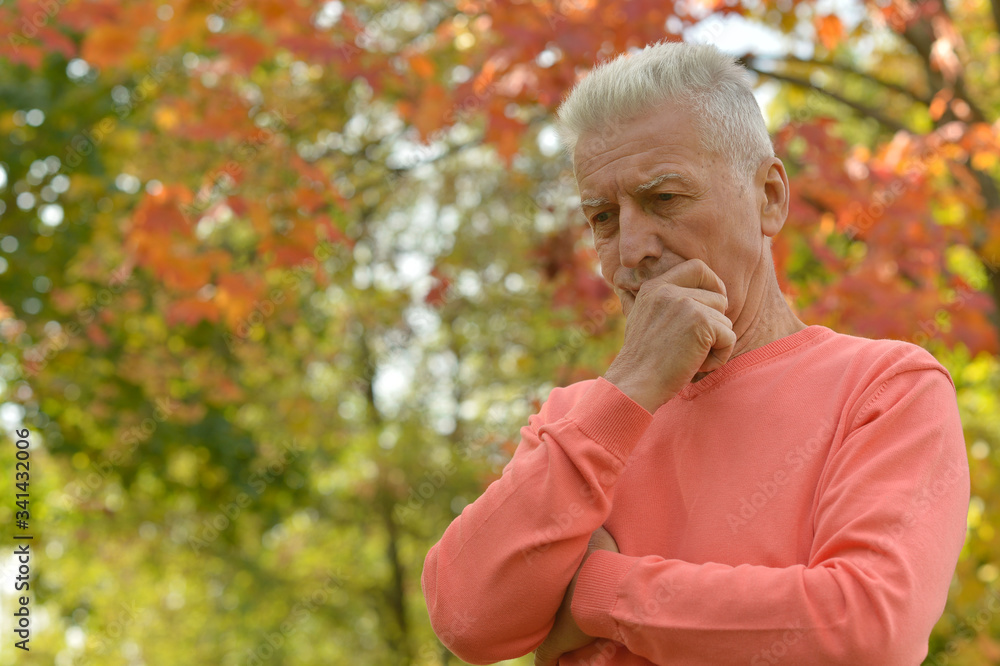 Portrait of senior man thinking in park Portrait of senior man thinking in park