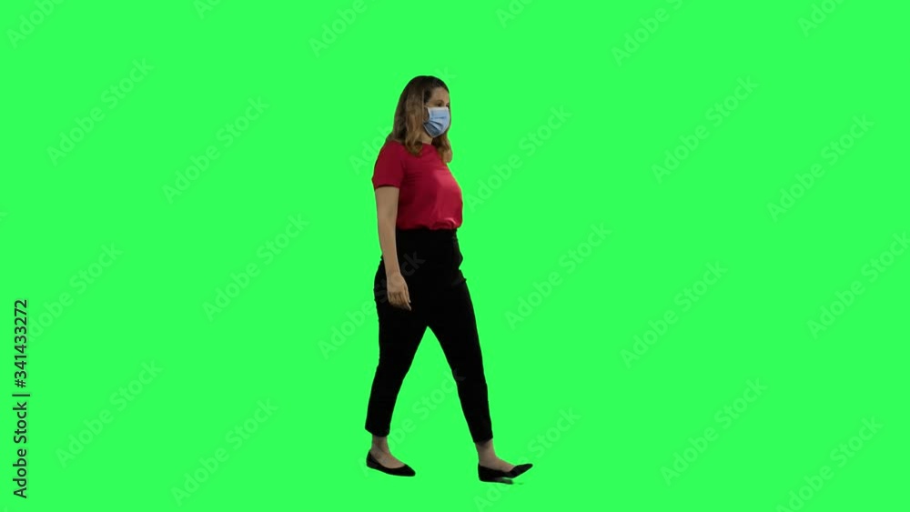 Woman with a surgical mask walking, celebrating and signing Woman with a surgical mask walking, celebrating and signing