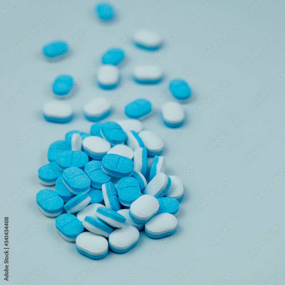 Blue-white pills isolated on a white background. Clipping path Blue-white pills isolated on a white background. Clipping path