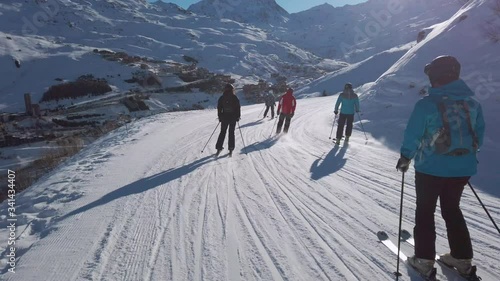 Skiing downhill first person point of view in the snowy mountain landscape. Skiing in the mountains, winter extreme sports