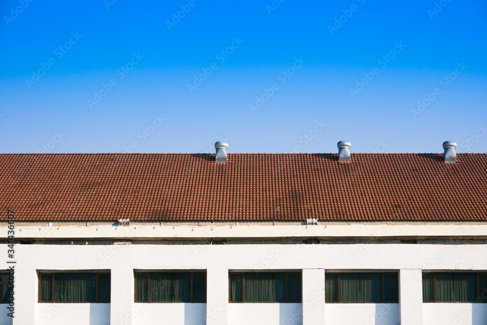 Air Ventilators on the roof top spinning and take cool air into the building