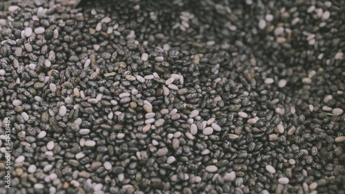 Chia seeds in a bowl with metal vintage spoons	