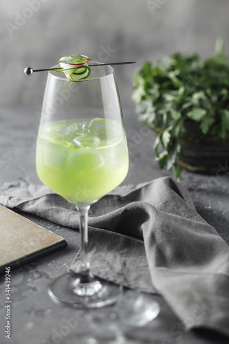 Photography alcoholic, non-alcoholic drink of light green color in a glass with a slice of c