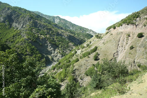 Mountainous road leading to Lahic village in Ismayilli region of Azerbaijan, with car.