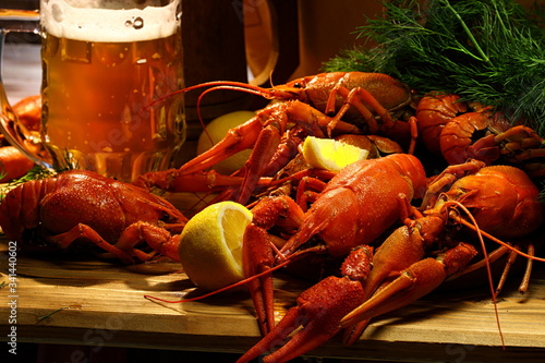 Crayfish with beer on a wooden table photo