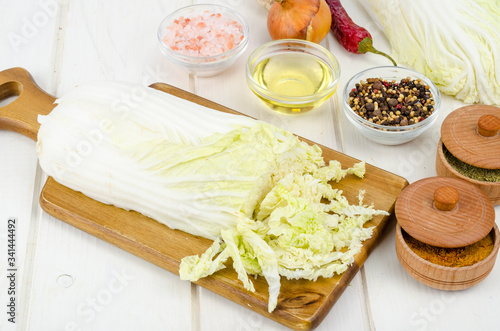 Sliced peking cabbage, spices for cooking vegetable diet dishes.