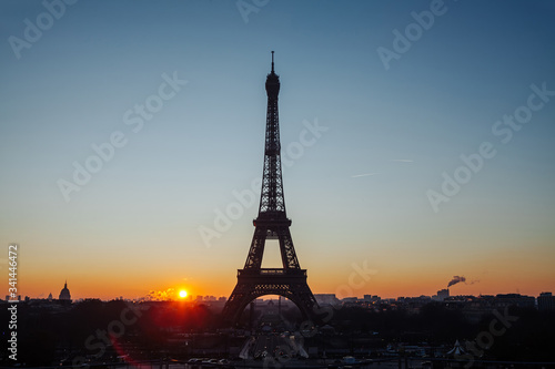 Eiffel tower silhouette against the backdrop of the rising sun. Beautiful sunrise over Paris © Владимир Никонов