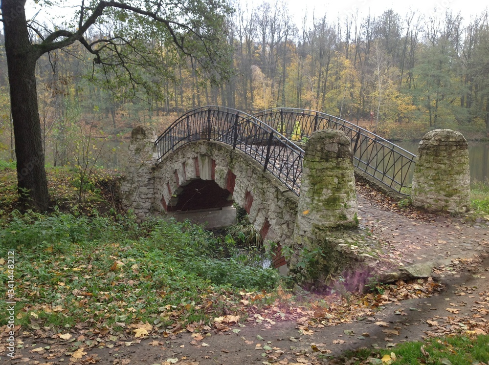 Old stone bridge in Moscow autumn park