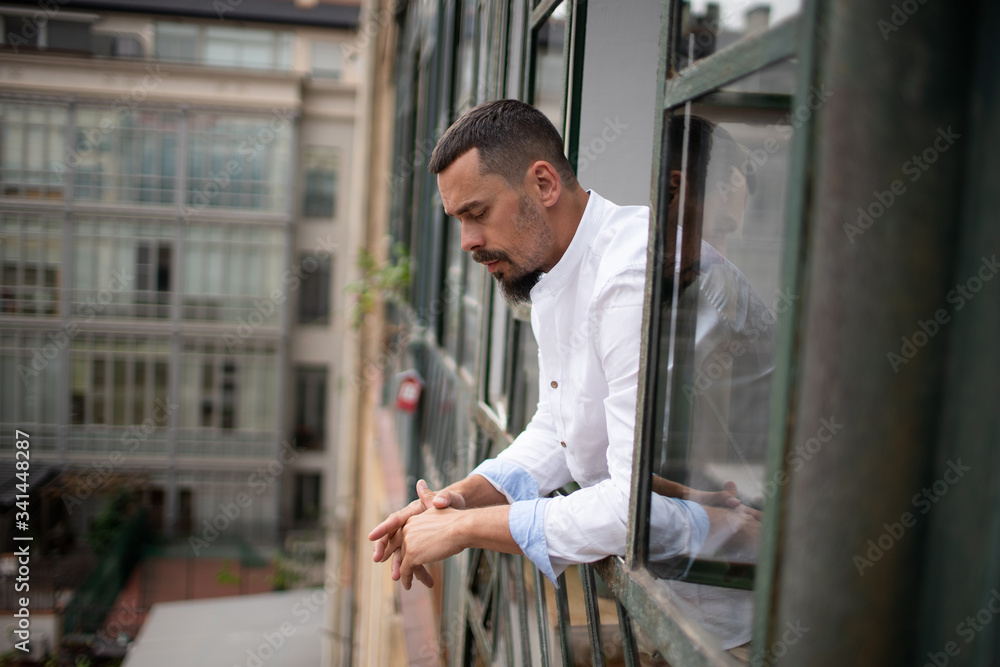 a young stylish man in an apartment in self-isolation