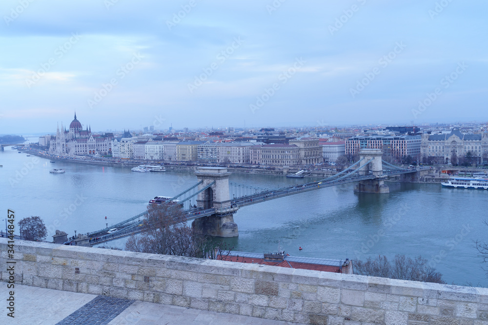 Naklejka premium Evening view upon Budapest. The Chain Bridge, Palace of Parliament and Danube river are just the perfect trio
