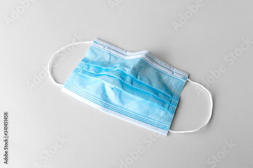 used crumple blue Color surgical mask in flat show in top view
