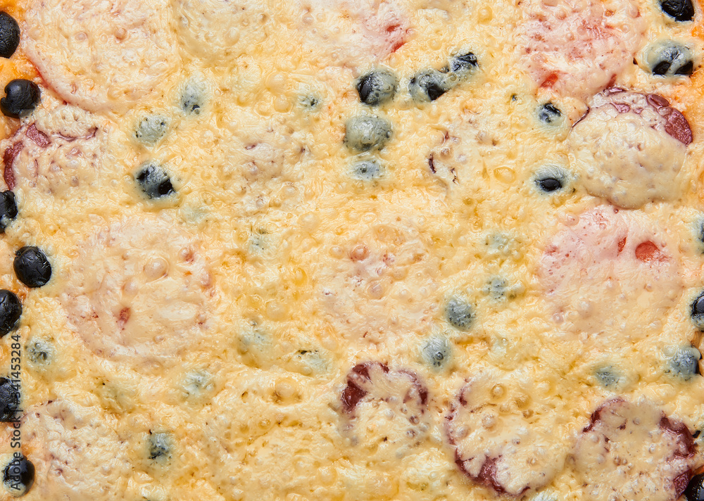 Pizza background. Closeup of a home made ready baked pizza with cheese, red onions, basil and tomato sauce. Pizza background. Pizza background. Closeup of a home made ready baked pizza with cheese, red onions, basil and tomato sauce. Pizza background.