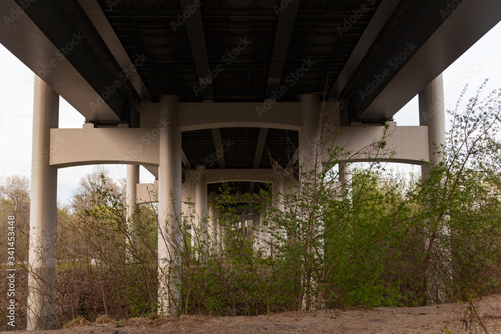 concrete supports of the road bridge from below concrete supports of the road bridge from below