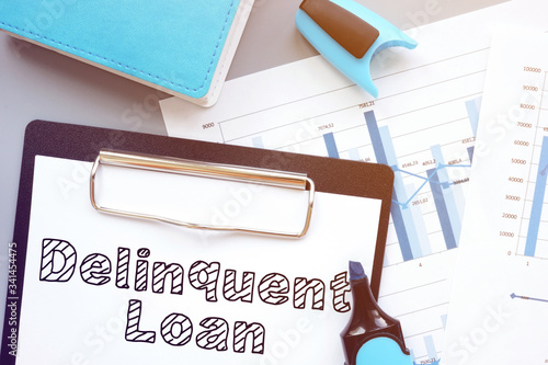 Delinquent loan is shown on the conceptual business photo