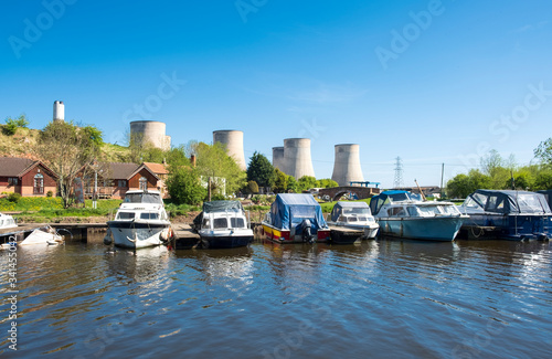 Various river boats moored in a marina photo