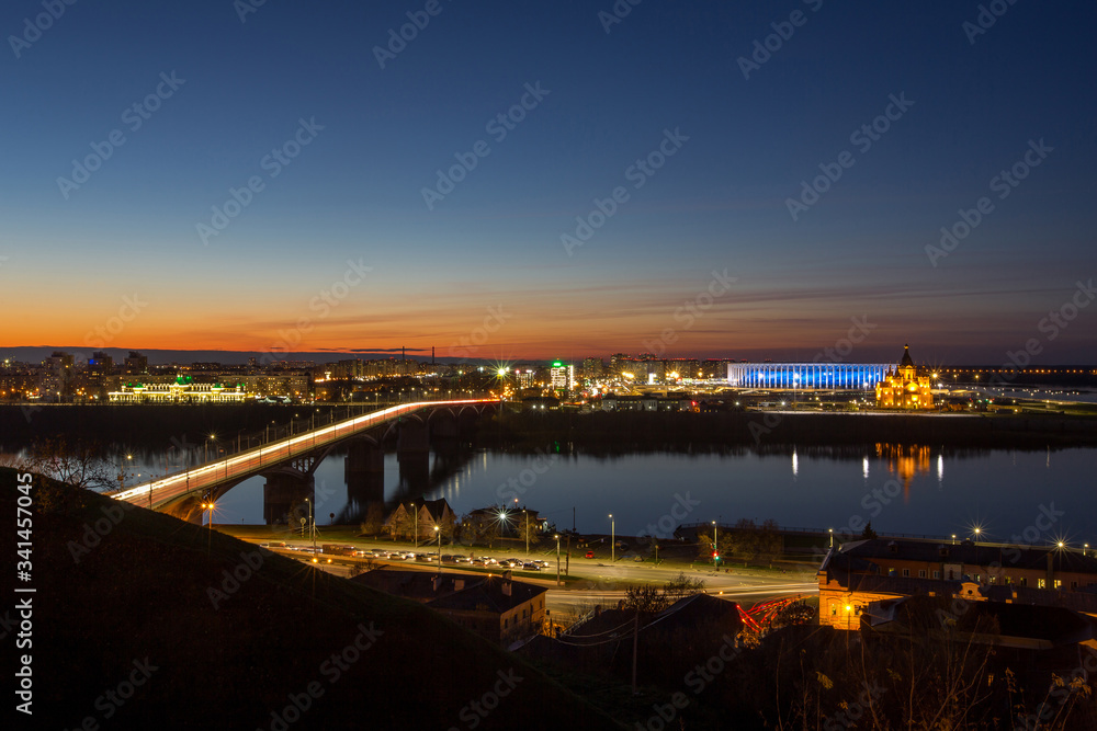 Fototapeta premium Night city lights reflected in the river. Nizhny Novgorod, the river Oka.