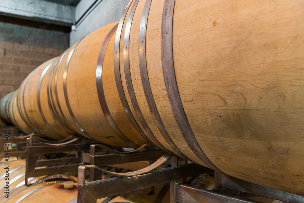 Oak wine barrels for wine fermentation at a winery Oak wine barrels for wine fermentation at a winery