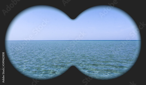 Sea view through binoculars. Seascape view via the field-glass. 