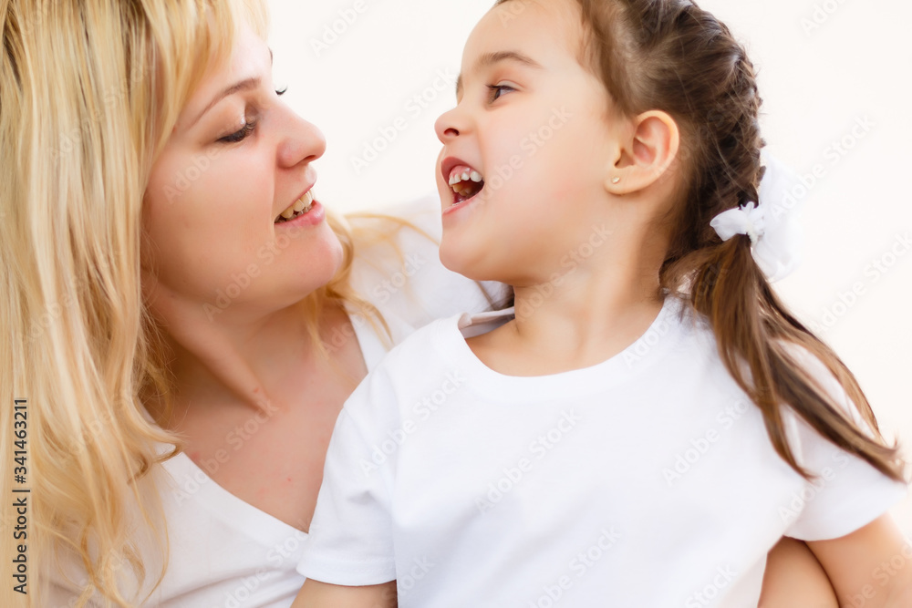 bright picture of hugging mother and daughter bright picture of hugging mother and daughter