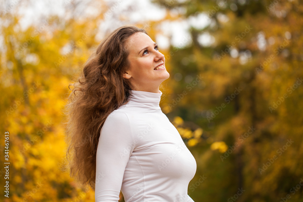 Portrait of a young beautiful girl in autumn park Portrait of a young beautiful girl in autumn park