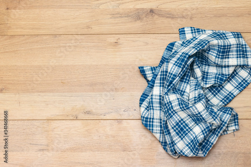 napkin tablecloth above wooden background