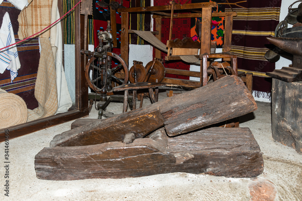 The ancient weaving loom in an interior. Old Weaving Workshop. The ancient weaving loom in an interior. Old Weaving Workshop.