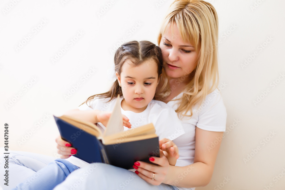 Mother and daughter doing homework at home Mother and daughter doing homework at home