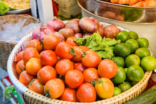 Big basket of vegetables at street bazaar