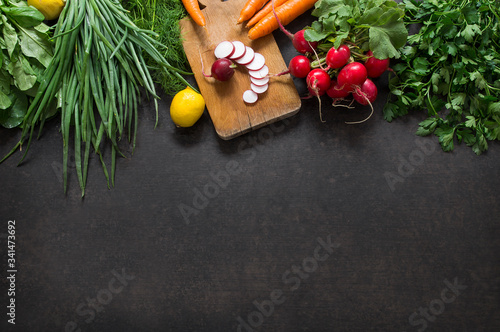 Salad vegetable concept with cutting board on rustic background, organic fresh and raw green vegetables, Healthy food, vegan or diet nutrition concept, top view space for text
