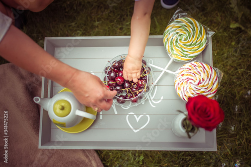 woman holding a bowl of fresh fruit