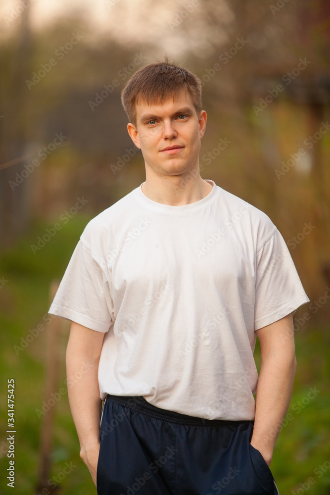 Agronomist handsome strong man with shovel on background of flower beds Agronomist handsome strong man with shovel on background of flower beds
