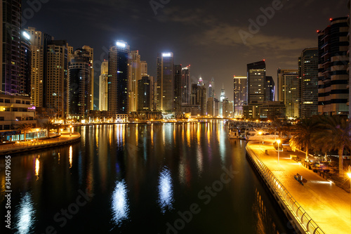 Highrise buildings at Dubai Marina illuminated at night © Dmitry Melnik