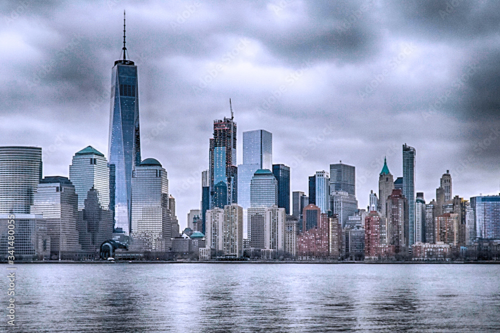 View of Manhattan Skyline, from Liberty State Park in Jersey City, New Jersey. Manhattan is the most densely populated of the five boroughs of New York City.