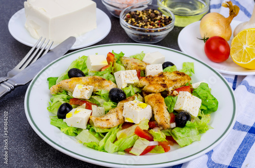 Vegetable salad with tofu and chicken breast.