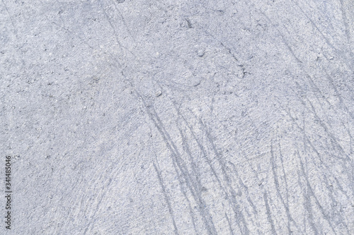 Gray abstract concrete wall background. Photo of a cement texture with scratches. For layouts or sites.